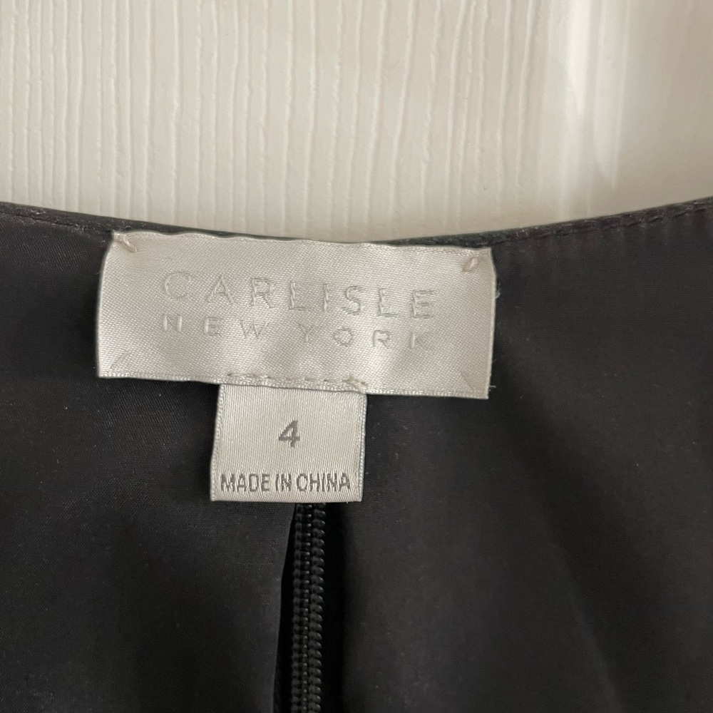 This is a full leather vest zip up the back very close fitting to the body